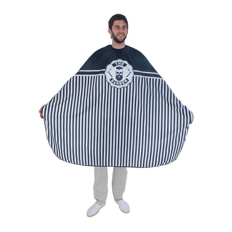 THE BARBER Barber cutting cape